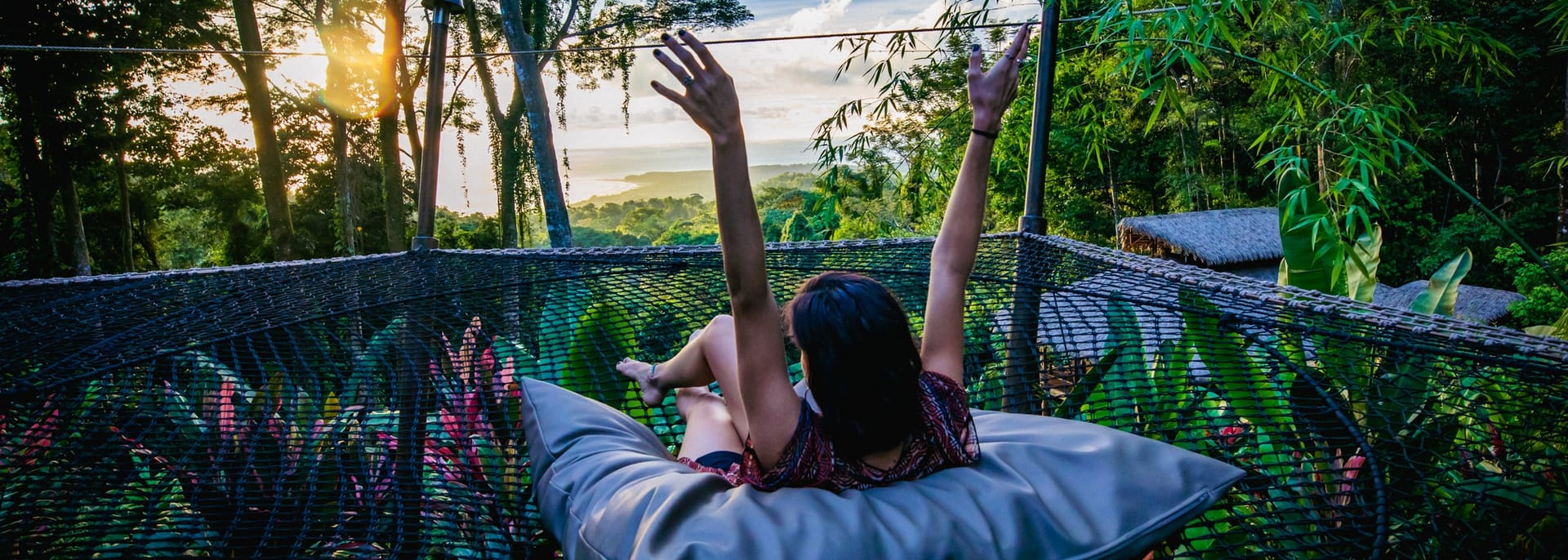 Woman in hammock overlooking ocean in Costa Rica